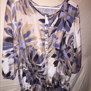 This blouse is 100% polyester and is NWT.